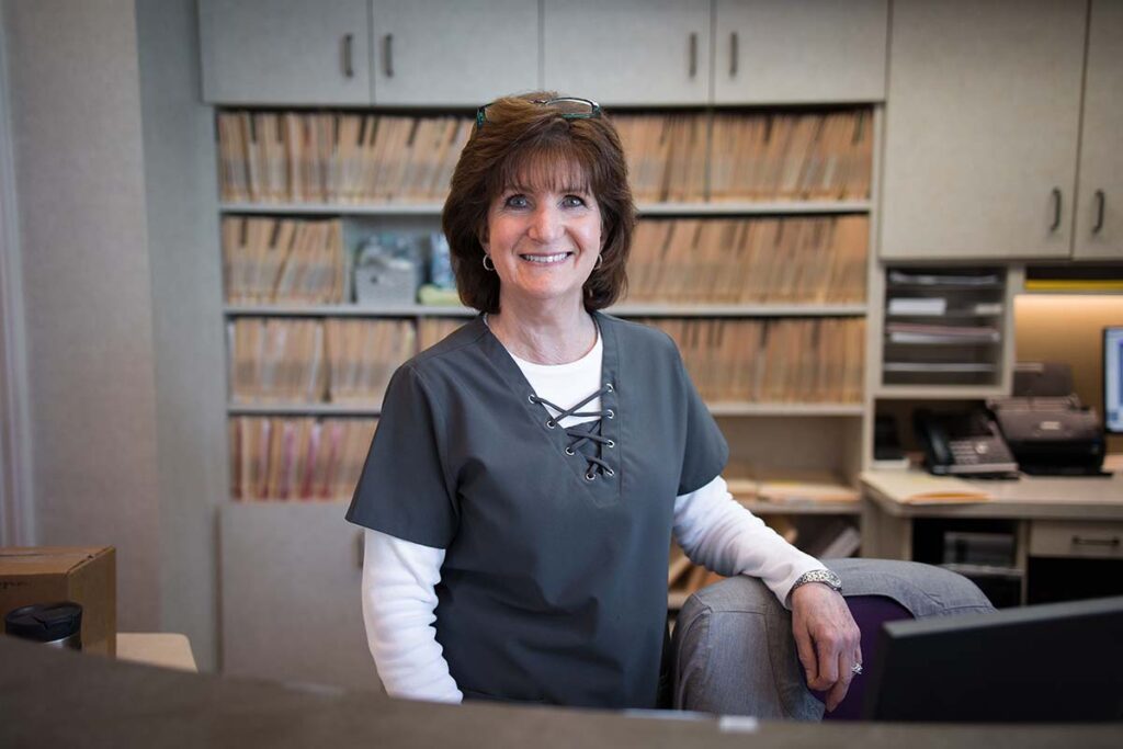 Rose-at-the-front-desk-of-Kelleher-Orthodontics-serving-downtown-folsom