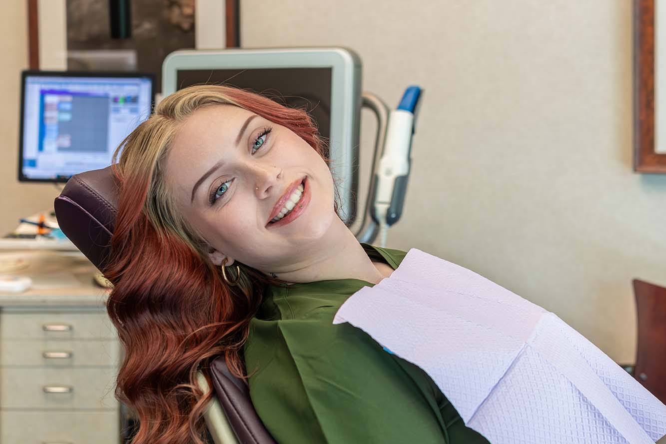 Happy orthodontic patient waiting for their appointment at Kelleher Orthodontics.