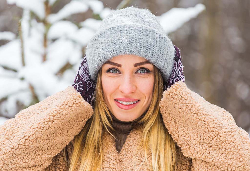 A close-up shot of Kelleher Orthodontics' clear ceramic braces on a patient, showcasing the discreet and aesthetic treatment option.